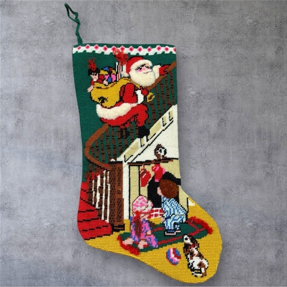 Vintage needlepoint Christmas stocking featuring design “Down The Bannister"